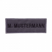 Namensband, grau/schwarze Schrift,